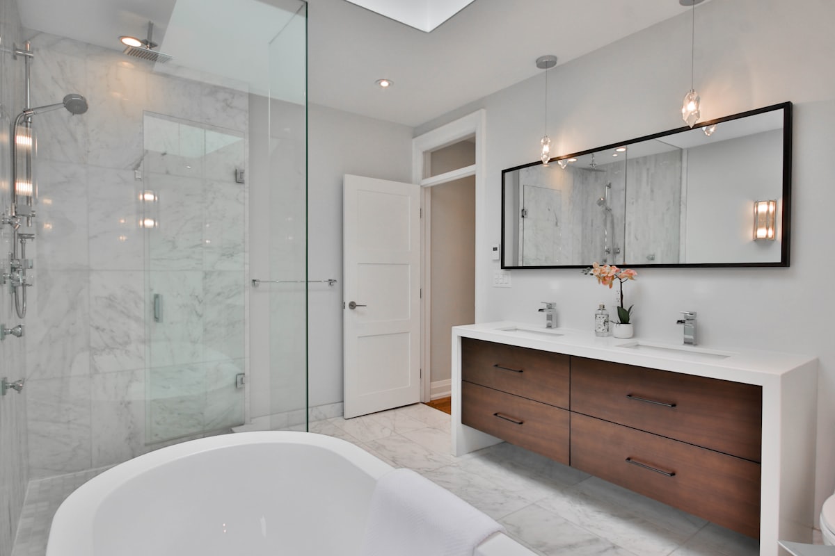 A refitted family bathroom with tiling and a bath