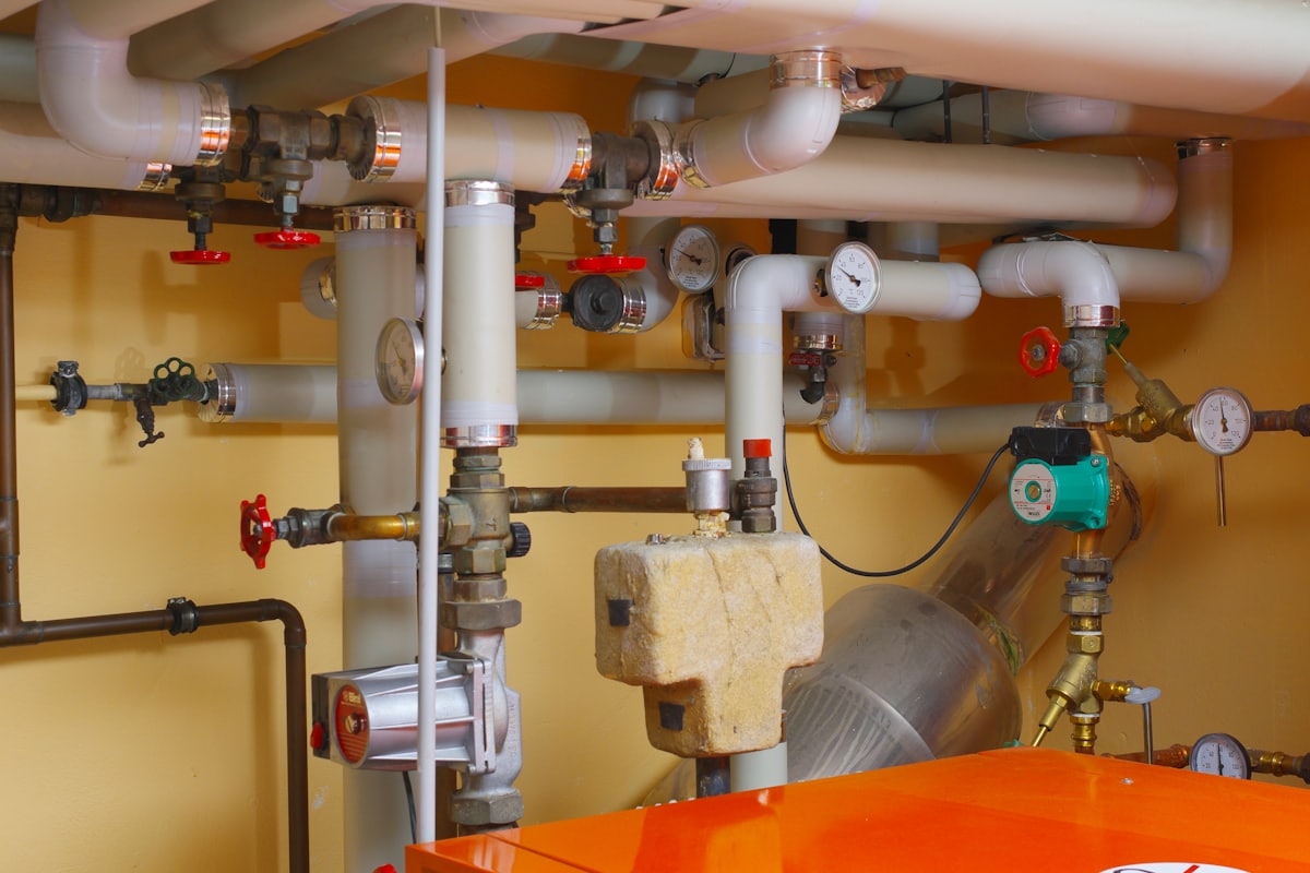 New boiler pipework and valves in a cupboard