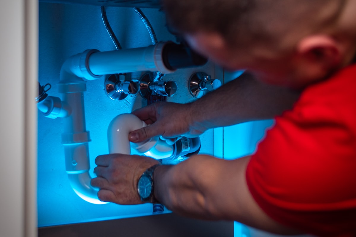 Repaired pipework under a kitchen unit